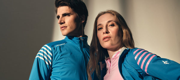 Male and female model are posing in blue golf clothes. 